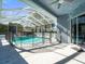 Screened pool area with safety fence at 10307 Ridge Top Loop, Weeki Wachee, FL 34613