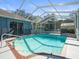 Inviting screened pool with brick coping at 10307 Ridge Top Loop, Weeki Wachee, FL 34613