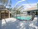 Large screened pool with storage shed at 10307 Ridge Top Loop, Weeki Wachee, FL 34613