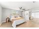 Spacious bedroom with a king-size bed and sliding barn door at 10744 Drummond Rd, Tampa, FL 33615