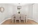 Bright dining room with a light-colored table and chairs at 10744 Drummond Rd, Tampa, FL 33615