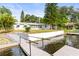 Private dock and steps leading to the water at 10744 Drummond Rd, Tampa, FL 33615