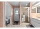 Bathroom with shower, toilet, and double vanity at 11363 Trumbull Dr, Spring Hill, FL 34609