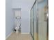 Clean bathroom with a glass shower and tiled floors at 11445 Deercroft Ct, Spring Hill, FL 34609