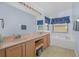 Bathroom features a double vanity and a bathtub at 11445 Deercroft Ct, Spring Hill, FL 34609