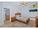 Main bedroom with ensuite access and a king-size bed at 11445 Deercroft Ct, Spring Hill, FL 34609