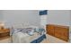 Cozy bedroom with wood dresser and a double bed at 11445 Deercroft Ct, Spring Hill, FL 34609
