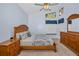 Main bedroom with a king-size bed and ensuite bathroom at 11445 Deercroft Ct, Spring Hill, FL 34609