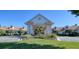 Elegant community center entrance with landscaping and grand design at 11445 Deercroft Ct, Spring Hill, FL 34609