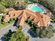 Aerial view of community clubhouse and pool at 11445 Deercroft Ct, Spring Hill, FL 34609
