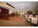 Spacious community room with a stage and hardwood dance floor at 11445 Deercroft Ct, Spring Hill, FL 34609