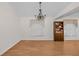 Dining room with built-in shelving and chandelier at 11445 Deercroft Ct, Spring Hill, FL 34609