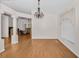 Simple dining room with hardwood floors and a chandelier at 11445 Deercroft Ct, Spring Hill, FL 34609