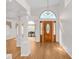 Bright foyer with hardwood floors and stained glass window at 11445 Deercroft Ct, Spring Hill, FL 34609