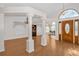 Bright foyer with hardwood floors and stained glass window at 11445 Deercroft Ct, Spring Hill, FL 34609