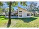 House exterior showcasing a screened patio at 11445 Deercroft Ct, Spring Hill, FL 34609