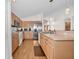 Efficient kitchen with light wood cabinets and stainless steel appliances at 11445 Deercroft Ct, Spring Hill, FL 34609