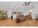 Living room, kitchen and dining area with hardwood floors at 11445 Deercroft Ct, Spring Hill, FL 34609