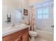 Bathroom with tub, shower, and wood vanity at 11544 Mcleod St, Spring Hill, FL 34609