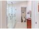 Bathroom with walk-in shower, grab bars, and toilet at 11544 Mcleod St, Spring Hill, FL 34609
