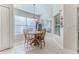 Bright breakfast nook with wood table and chairs near kitchen at 11544 Mcleod St, Spring Hill, FL 34609