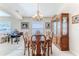 Elegant dining room featuring a wood table, chairs, and hutch at 11544 Mcleod St, Spring Hill, FL 34609