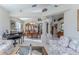 Open dining room with wooden table and chairs, adjacent to the living room at 11544 Mcleod St, Spring Hill, FL 34609