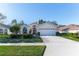Attractive single-story home with a two-car garage and lush landscaping at 11544 Mcleod St, Spring Hill, FL 34609