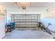 Garage with storage and an open garage door at 11544 Mcleod St, Spring Hill, FL 34609