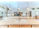 Kitchen island with sink and view to living room at 11544 Mcleod St, Spring Hill, FL 34609