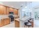 Well-equipped kitchen with ample wooden cabinetry and stainless steel appliances at 11544 Mcleod St, Spring Hill, FL 34609