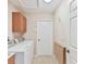 Laundry room with washer, dryer, cabinets, and folding table at 11544 Mcleod St, Spring Hill, FL 34609