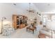 Comfortable living room featuring a large entertainment center and recliner at 11544 Mcleod St, Spring Hill, FL 34609