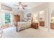 Main bedroom with carpeted floor and wood furniture at 11544 Mcleod St, Spring Hill, FL 34609