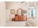 Main bedroom features dresser and large mirror at 11544 Mcleod St, Spring Hill, FL 34609