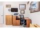 Home office with corner desk and printer at 11544 Mcleod St, Spring Hill, FL 34609