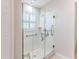 Walk-in shower with glass enclosure and grab bars at 11544 Mcleod St, Spring Hill, FL 34609