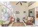 Sunroom featuring wicker furniture and a ceiling fan at 11544 Mcleod St, Spring Hill, FL 34609