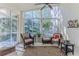 Spacious sunroom with ample natural light and seating at 11544 Mcleod St, Spring Hill, FL 34609