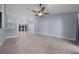 Spacious living room with tile flooring and a ceiling fan at 12141 Hermes Ct, Brooksville, FL 34601