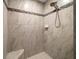 Large walk-in shower with tiled walls and built-in seat at 12141 Hermes Ct, Brooksville, FL 34601