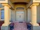 Front entrance with columns and double doors at 12482 Meinert Ave, Brooksville, FL 34613