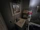 Small bathroom with sink and linen shelving at 12924 Manatee Ave, New Port Richey, FL 34654