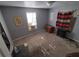 Small bedroom with window, closet, and wood stove at 12924 Manatee Ave, New Port Richey, FL 34654