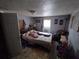 Simple bedroom with double bed, window, and closet at 12924 Manatee Ave, New Port Richey, FL 34654