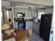Gray kitchen cabinets, laminate flooring, and a full appliance package at 12924 Manatee Ave, New Port Richey, FL 34654