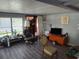 Living room with gray flooring and a large window at 12924 Manatee Ave, New Port Richey, FL 34654