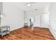 Well-lit bedroom with wood flooring and ensuite bathroom access at 1427 Loretto Cir, Odessa, FL 33556