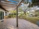 Covered patio with pergola, offering scenic views of the water at 1928 Gulfview Dr, Holiday, FL 34691