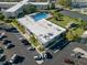 Aerial view showing pool, building, and parking at 2210 Utopian E Dr # 212, Clearwater, FL 33763